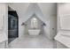 Sleek main bathroom with a soaking tub under a window and a black tiled shower at 785 Charleston Dr, Roswell, GA 30075