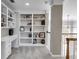 Upstairs office space with built-in shelving, a desk, and neutral carpet, perfect for working from home at 785 Charleston Dr, Roswell, GA 30075
