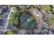 Arial view of a community pond with fountain and apartment buildings at 1379 Keys Lake Ne Dr, Brookhaven, GA 30319