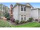 Condo building exterior showcasing landscaping and walkway at 1379 Keys Lake Ne Dr, Brookhaven, GA 30319