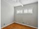 Bedroom with hardwood floors and large windows at 2301 Drew Valley Ne Rd, Brookhaven, GA 30319