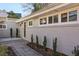 Front entry of gray brick ranch home with walkway and landscaping at 2301 Drew Valley Ne Rd, Brookhaven, GA 30319