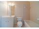 Neutral bathroom featuring a single sink vanity, toilet, and shower-tub combo at 3184 Islesworth Trce, Duluth, GA 30097