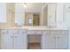 Bright bathroom with double vanity, white cabinets, and a large mirror at 3184 Islesworth Trce, Duluth, GA 30097