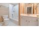 Bathroom featuring a white vanity, toilet, and shower-tub combination at 3184 Islesworth Trce, Duluth, GA 30097
