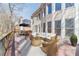 Spacious outdoor deck with comfortable wicker furniture and a view of the backyard at 3184 Islesworth Trce, Duluth, GA 30097