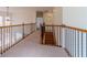 Upstairs hallway featuring iron and wood banister and stairs at 3184 Islesworth Trce, Duluth, GA 30097