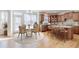Eat-in kitchen with stainless steel appliances, hardwood floors, island and adjacent eating nook at 3184 Islesworth Trce, Duluth, GA 30097