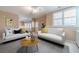 Living area featuring natural light, two sofas, and a stylish rug at 3184 Islesworth Trce, Duluth, GA 30097