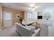 Inviting living area with built-in shelving, a ceiling fan, and comfortable seating at 3184 Islesworth Trce, Duluth, GA 30097