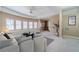 Spacious living room with a sitting area, large windows, and a neutral color palette at 3184 Islesworth Trce, Duluth, GA 30097