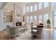 Bright living room boasts a fireplace, built-in bookshelves and soaring windows at 3184 Islesworth Trce, Duluth, GA 30097