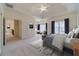 Spacious main bedroom features a tray ceiling, a seating area and large windows at 3184 Islesworth Trce, Duluth, GA 30097