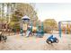 Community playground with slides, swings, and a seesaw at 3184 Islesworth Trce, Duluth, GA 30097