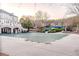 Large covered pool with a water slide feature at a light-colored two-story house at 3184 Islesworth Trce, Duluth, GA 30097