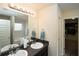 Double vanity bathroom with walk-in shower and access to closet at 3107 Rex Ridge Cir, Rex, GA 30273