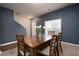 Simple dining area with wooden table and chairs near entryway at 3107 Rex Ridge Cir, Rex, GA 30273