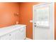 Laundry room with white cabinets and a utility sink at 5339 Saville Nw Dr, Acworth, GA 30101