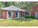 Brick patio with sliding doors leading to backyard at 619 Champions Dr, Mcdonough, GA 30253