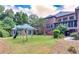 Large backyard with playground and screened porch at 619 Champions Dr, Mcdonough, GA 30253