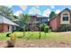 Large backyard with playground and home view at 619 Champions Dr, Mcdonough, GA 30253