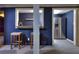 Basement bar with wet bar, mini fridge, and seating at 619 Champions Dr, Mcdonough, GA 30253