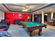 Game room with pool table and red wall at 619 Champions Dr, Mcdonough, GA 30253