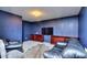 Finished basement rec room with a large TV at 619 Champions Dr, Mcdonough, GA 30253