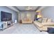 Finished basement recreation room with couches and TV at 619 Champions Dr, Mcdonough, GA 30253