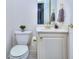 Small half bathroom with toilet and sink at 619 Champions Dr, Mcdonough, GA 30253