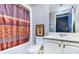Clean bathroom with a shower/tub combo and double vanity at 619 Champions Dr, Mcdonough, GA 30253