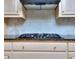 Modern gas cooktop with granite countertop at 619 Champions Dr, Mcdonough, GA 30253