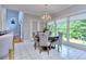 Sunlit dining area with round table and chairs, overlooking backyard at 619 Champions Dr, Mcdonough, GA 30253