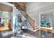 Elegant entryway with staircase and granite flooring at 619 Champions Dr, Mcdonough, GA 30253