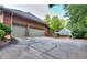 Two-car garage with brick exterior and driveway at 619 Champions Dr, Mcdonough, GA 30253