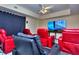 Home theater with red and black reclining chairs at 619 Champions Dr, Mcdonough, GA 30253