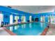 Indoor pool with blue walls and a basketball hoop at 619 Champions Dr, Mcdonough, GA 30253