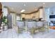 Modern kitchen with breakfast bar, gray velvet stools and granite countertops at 619 Champions Dr, Mcdonough, GA 30253