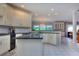 Open kitchen with breakfast bar, white cabinets, and granite countertops at 619 Champions Dr, Mcdonough, GA 30253