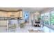 Eat-in kitchen with breakfast nook, island, and lots of natural light at 619 Champions Dr, Mcdonough, GA 30253