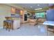 Eat-in kitchen with island, granite countertops, and bar seating at 619 Champions Dr, Mcdonough, GA 30253