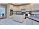 Spacious kitchen with island, granite countertops, and stainless steel appliances at 619 Champions Dr, Mcdonough, GA 30253