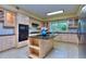 Spacious kitchen with granite countertops, island, and stainless steel appliances at 619 Champions Dr, Mcdonough, GA 30253