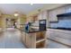 Open kitchen with island, granite countertops and breakfast bar at 619 Champions Dr, Mcdonough, GA 30253