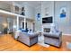 Elegant living room boasts hardwood floors, fireplace, and two-story high ceilings at 619 Champions Dr, Mcdonough, GA 30253