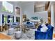Bright living room featuring hardwood floors, large windows, and comfortable seating at 619 Champions Dr, Mcdonough, GA 30253