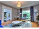 Bright office with large window and marble-top table at 619 Champions Dr, Mcdonough, GA 30253