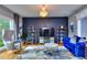 Stylish office with blue velvet sofa and gold accents at 619 Champions Dr, Mcdonough, GA 30253