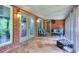 Screened porch with brick flooring and seating at 619 Champions Dr, Mcdonough, GA 30253