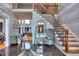 Grand staircase with ornate railing and granite flooring at 619 Champions Dr, Mcdonough, GA 30253